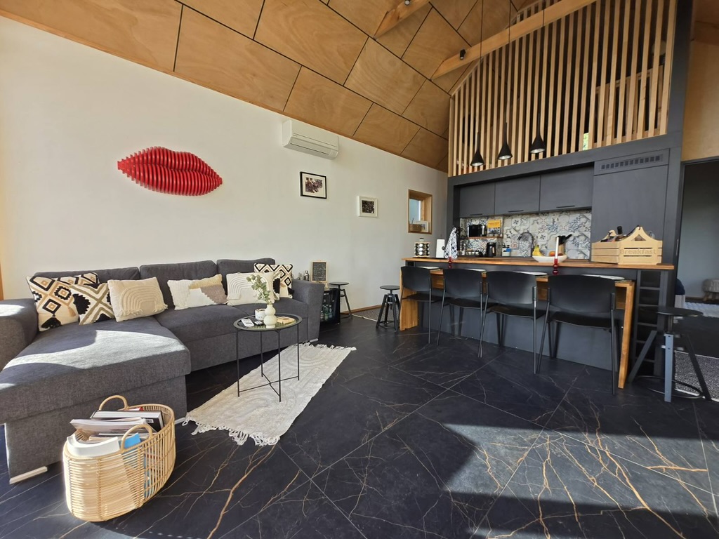 Living room with kitchen and lofted ceiling