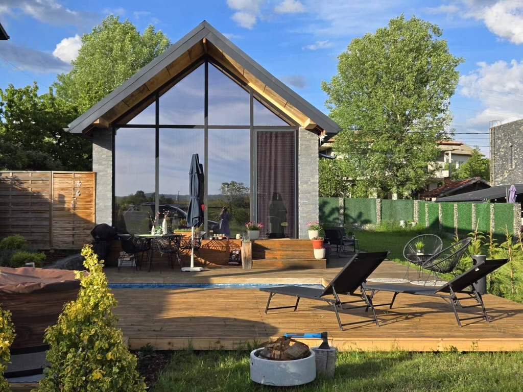 Exterior view of the A-frame villa with pool